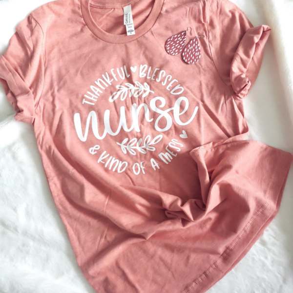 Pumpkin heather tshirt with white letters that say Thankful Blessed and Kind of a Mess Nurse