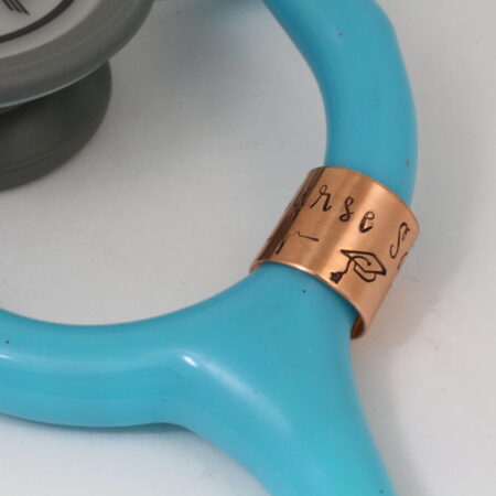 Copper stethoscope charm with graduation cap