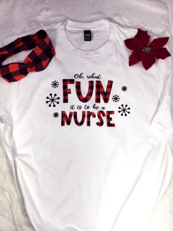 White tshirt with buffalo plaid red and black print that says Oh what fun it is to be a nurse with buffalo plaid headband