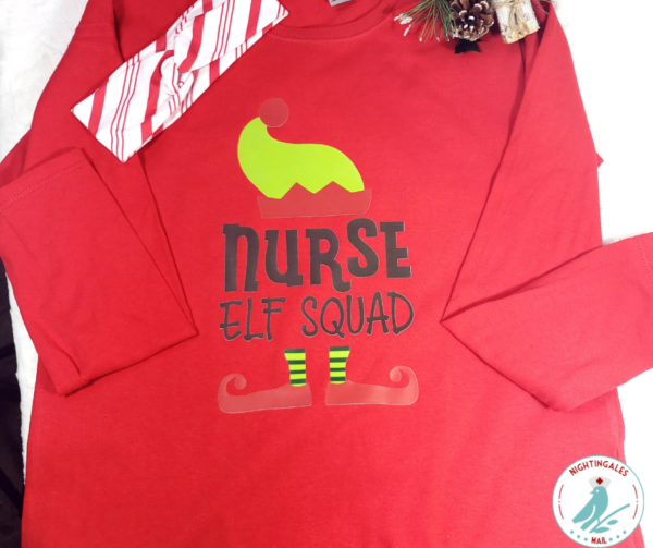 Long sleeved red shirt with graphic that says Nurse Elf Squad with elft hat and feet with red and white stripe headband