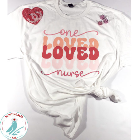 White tshirt that says one Loved Loved Loved nurse