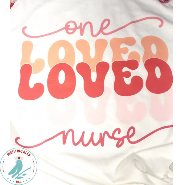 Closeup of image that says one loved nurse on white tshirt